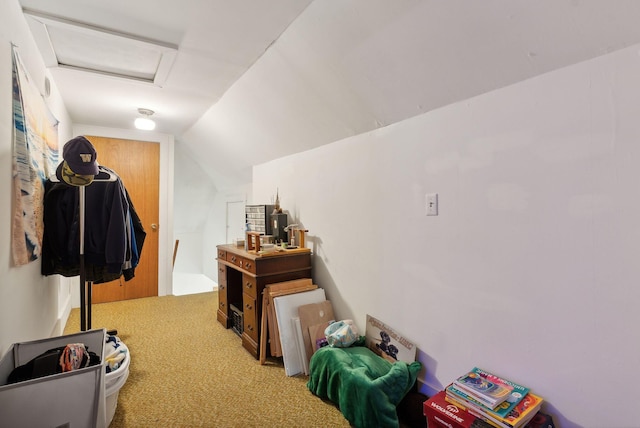 interior space with carpet and vaulted ceiling