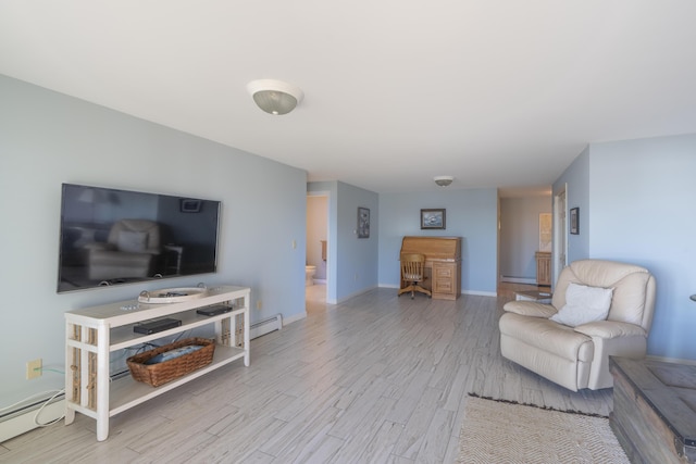 living area with baseboards, a baseboard heating unit, and wood finished floors