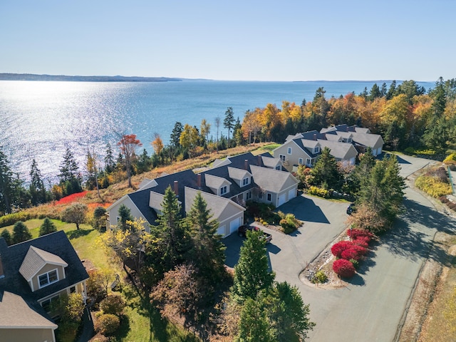 drone / aerial view featuring a water view and a residential view