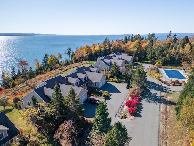 drone / aerial view with a residential view and a water view