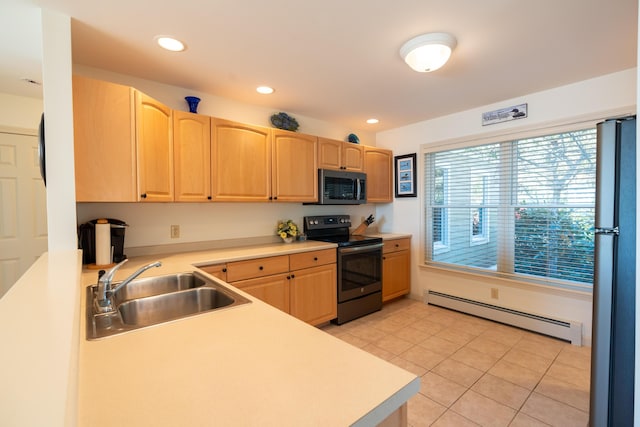 kitchen featuring a sink, light brown cabinetry, a baseboard radiator, and range with electric stovetop