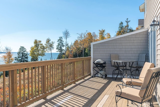 wooden terrace with a water view
