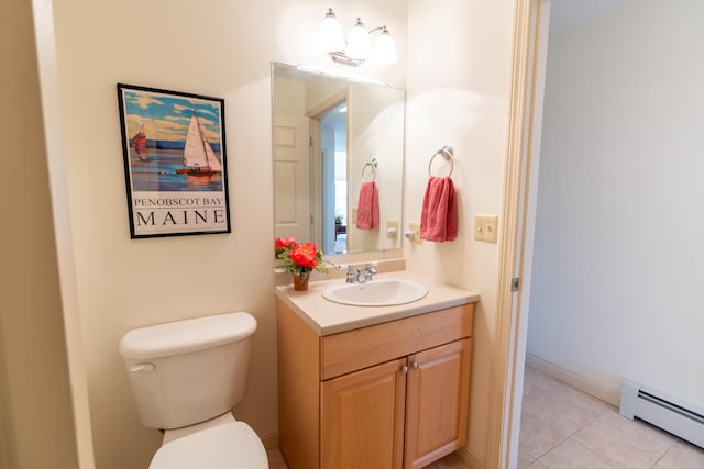 bathroom with vanity, tile patterned floors, a baseboard heating unit, and toilet
