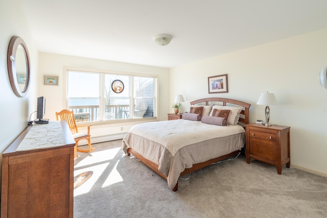 bedroom with baseboards and light carpet