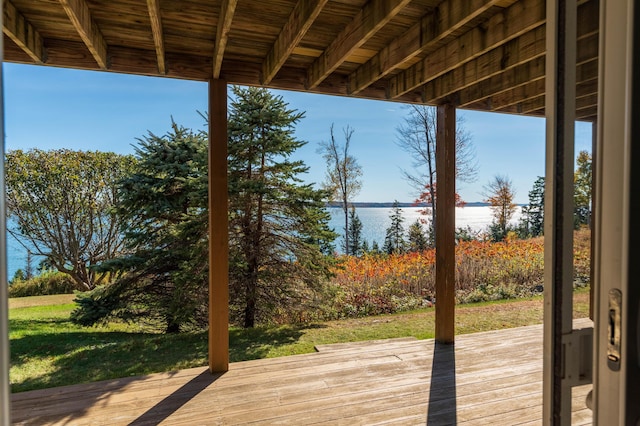 exterior space with a lawn and a water view