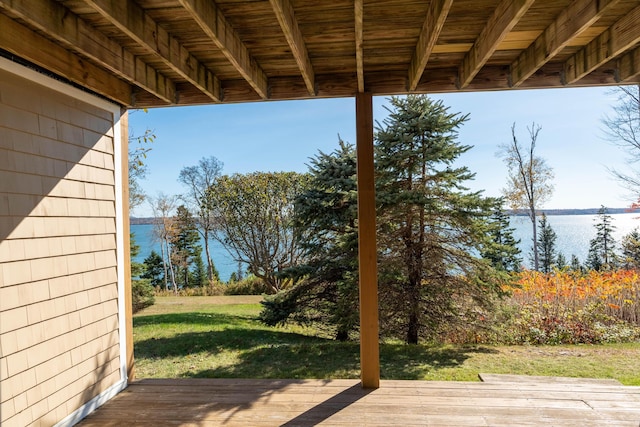deck featuring a yard and a water view