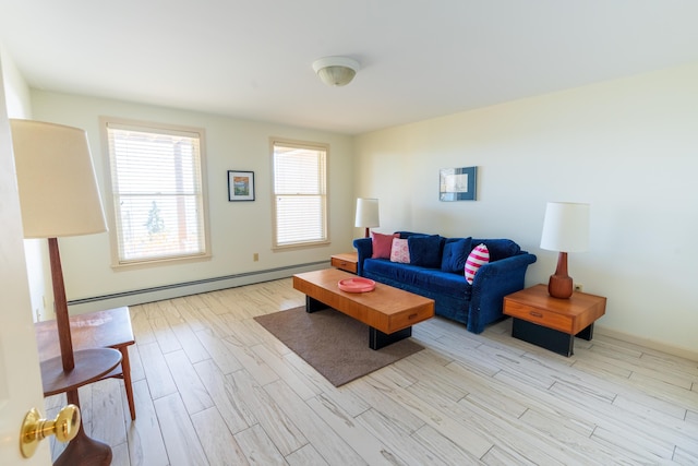 living area featuring wood finished floors and a baseboard heating unit