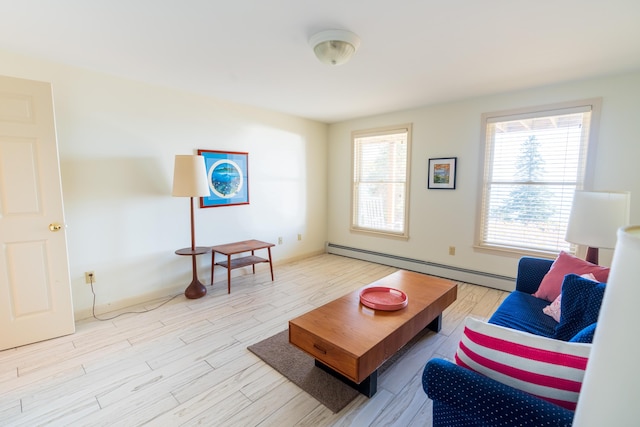 living room with baseboards, baseboard heating, and wood finished floors