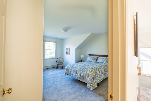carpeted bedroom with a baseboard heating unit