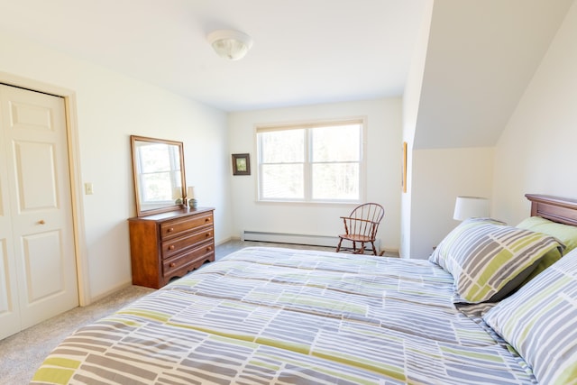 bedroom featuring a baseboard heating unit and light carpet