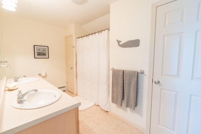 full bathroom with double vanity, tile patterned floors, curtained shower, and a sink