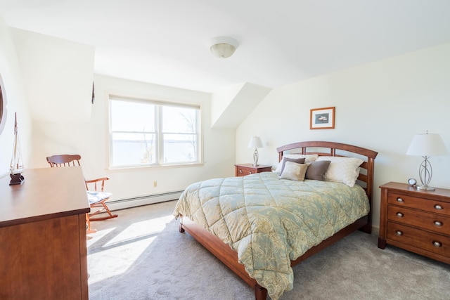 bedroom with baseboard heating and light carpet
