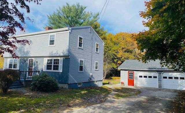 view of front of house with an outdoor structure and a garage