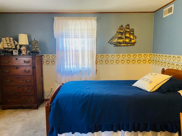 bedroom featuring ornamental molding and light carpet