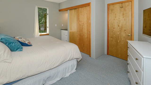 bedroom featuring light carpet