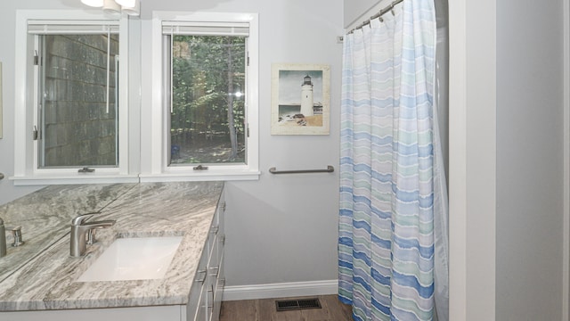 bathroom with vanity, hardwood / wood-style flooring, tasteful backsplash, and a shower with curtain