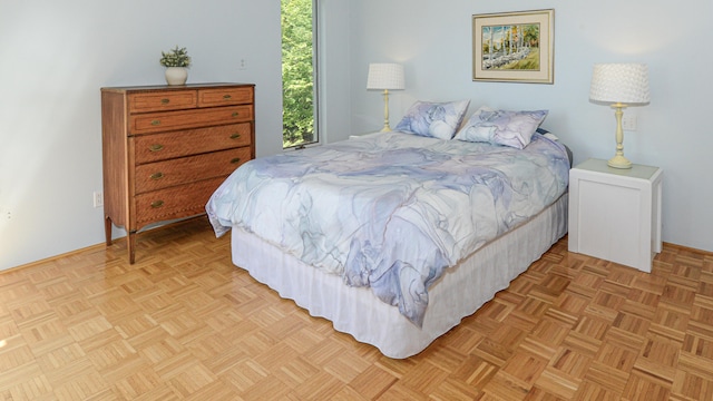 bedroom with light parquet floors