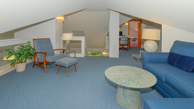 carpeted living room with a textured ceiling and vaulted ceiling