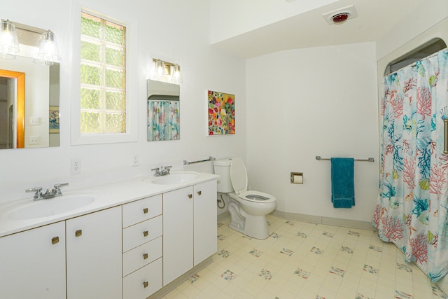 bathroom featuring vanity, a shower with curtain, and toilet