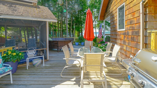 wooden terrace with a grill