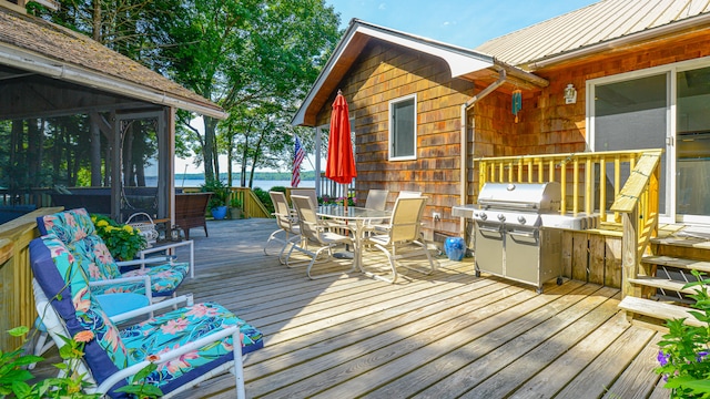 deck featuring a water view