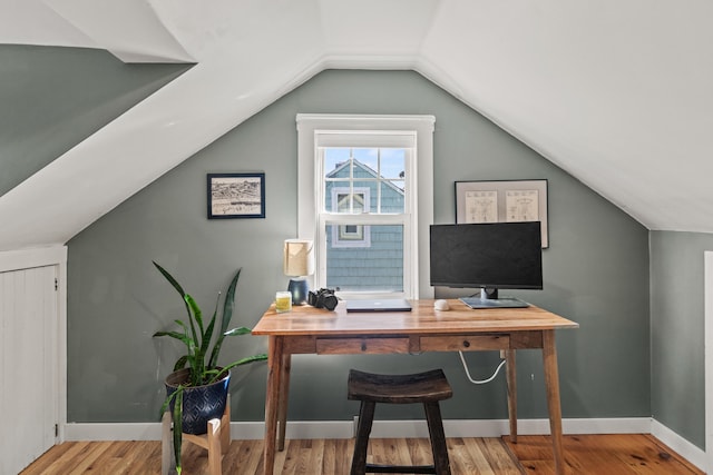 office area with lofted ceiling and hardwood / wood-style floors