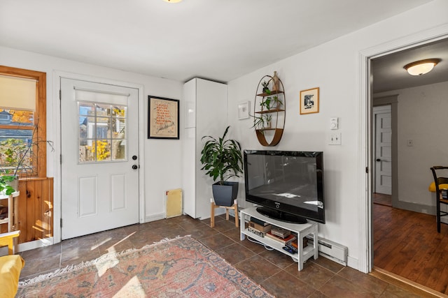 entrance foyer featuring dark hardwood / wood-style floors and a baseboard heating unit