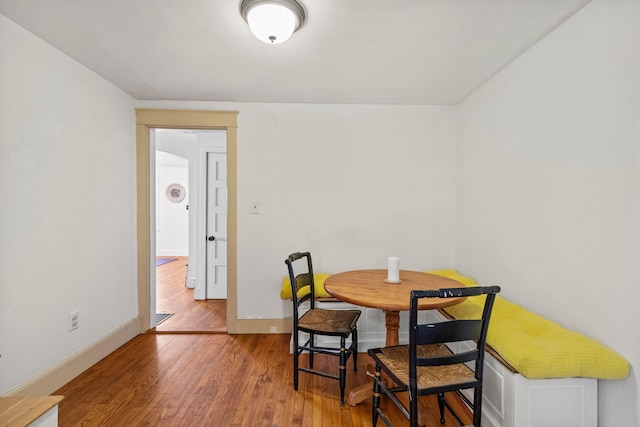 dining space featuring hardwood / wood-style floors