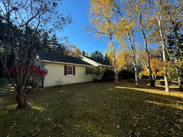 view of property exterior featuring a yard