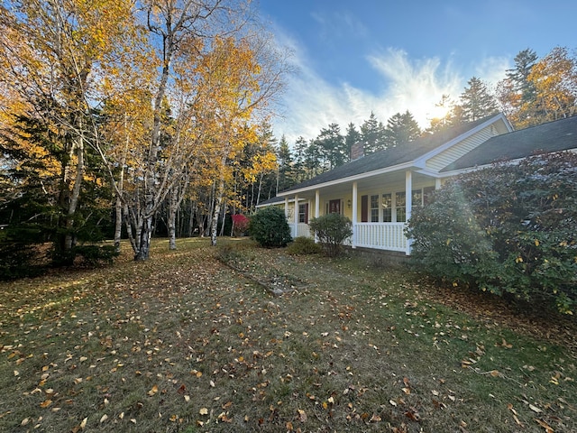 view of property exterior with covered porch