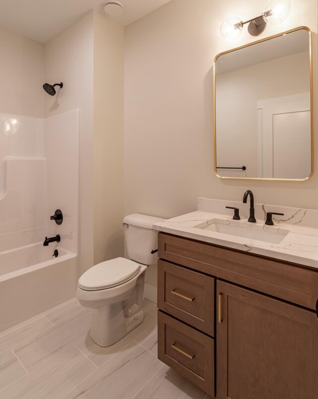 full bathroom featuring washtub / shower combination, toilet, and vanity