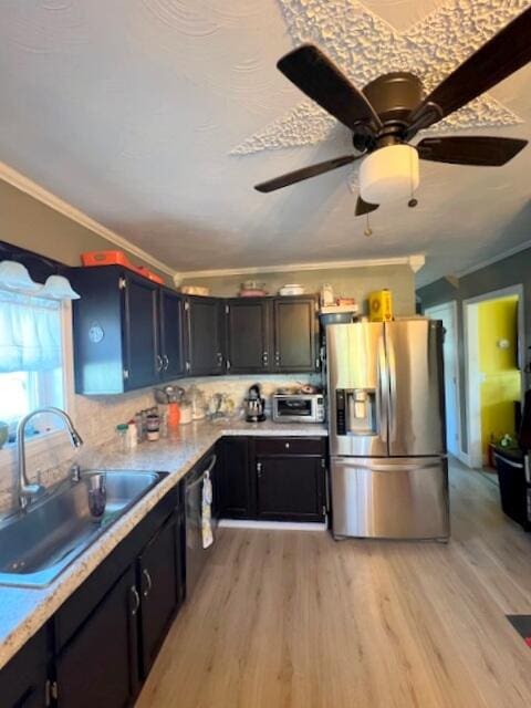 kitchen featuring ornamental molding, light hardwood / wood-style floors, sink, and stainless steel fridge with ice dispenser