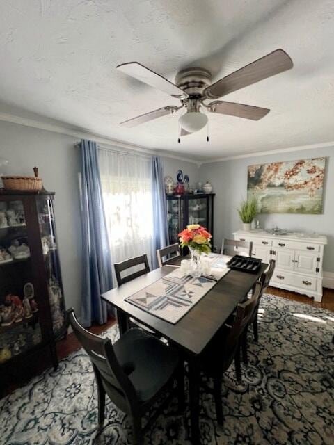 dining area with ceiling fan, hardwood / wood-style floors, and ornamental molding