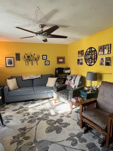 living room with carpet and ceiling fan