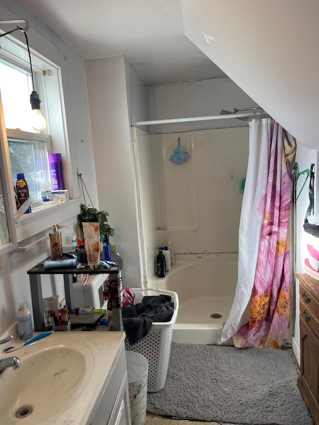 bathroom with vanity and curtained shower