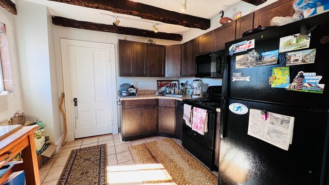 kitchen with beamed ceiling, black appliances, dark brown cabinets, and light tile patterned floors