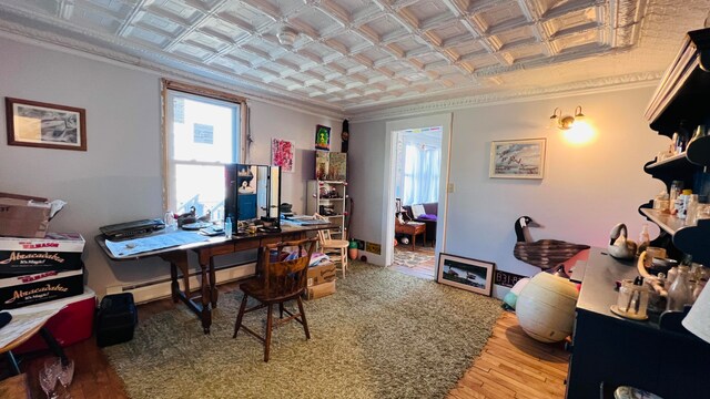 office area with ornamental molding and wood-type flooring