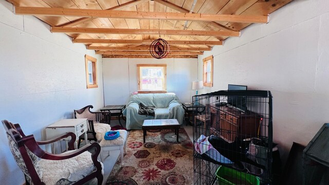 interior space with wood ceiling and vaulted ceiling with beams