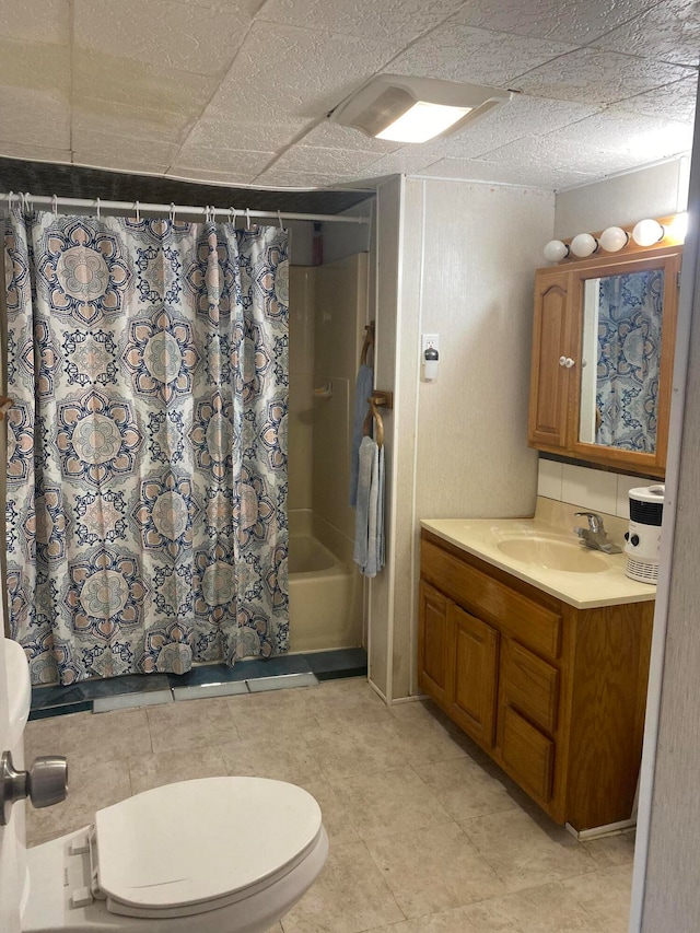 full bathroom featuring vanity, toilet, and shower / bath combo with shower curtain