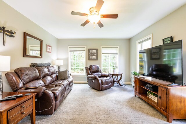 living room featuring ceiling fan and light carpet