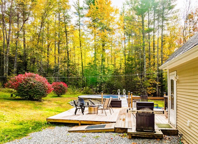 view of patio / terrace featuring a deck and grilling area