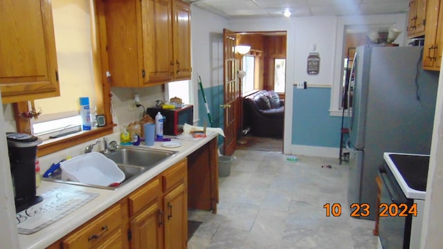 kitchen featuring sink and white appliances