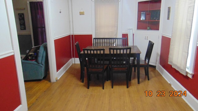 dining area with light hardwood / wood-style floors