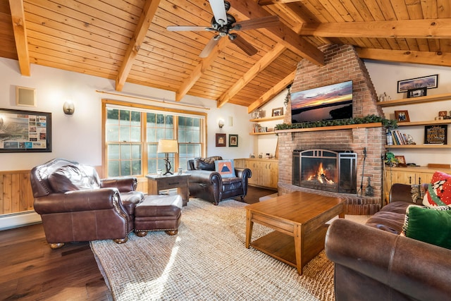 living room with a fireplace, wooden ceiling, hardwood / wood-style floors, and lofted ceiling with beams