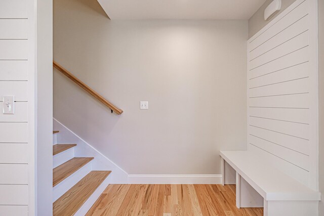 mudroom featuring baseboards and light wood-type flooring