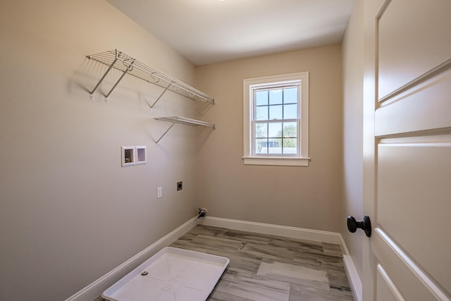 laundry area with hookup for an electric dryer, laundry area, baseboards, and hookup for a washing machine