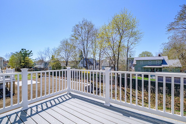 wooden deck with a residential view