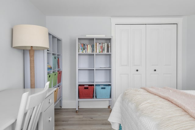 bedroom featuring a closet and light hardwood / wood-style flooring