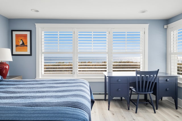 bedroom with light hardwood / wood-style floors