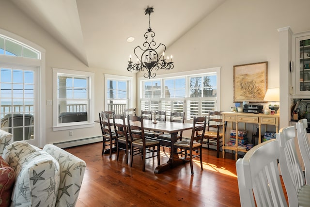 dining space featuring a notable chandelier, high vaulted ceiling, dark hardwood / wood-style flooring, and a baseboard heating unit